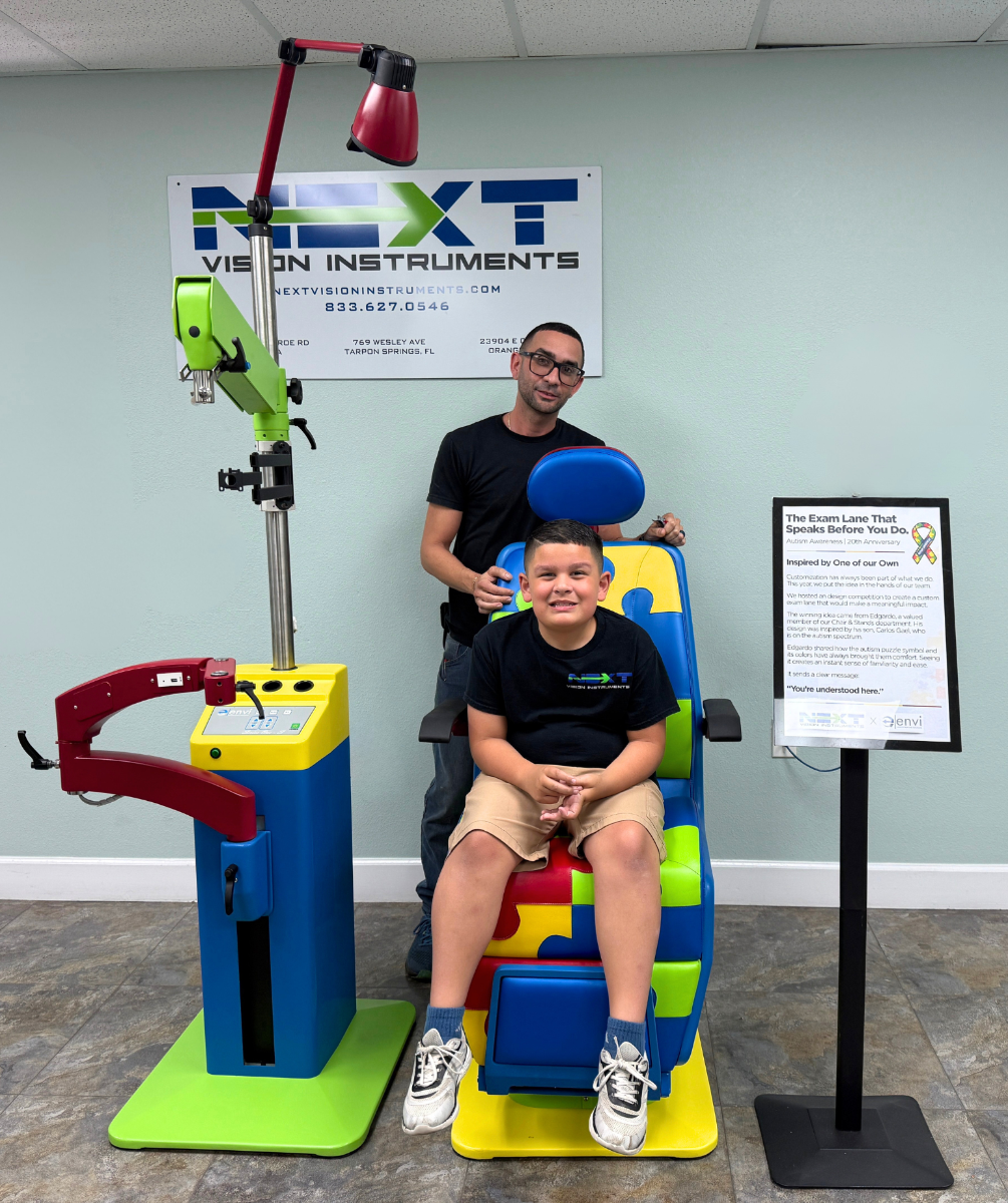 Edgardo and Carlos Gael with the custom Autism Awareness chair and stand by Next Vision Instruments
